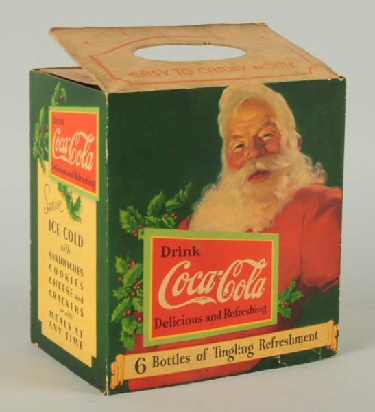 CARDBOARD COCA-COLA 6-PACK CARRIER WITH SANTA.    