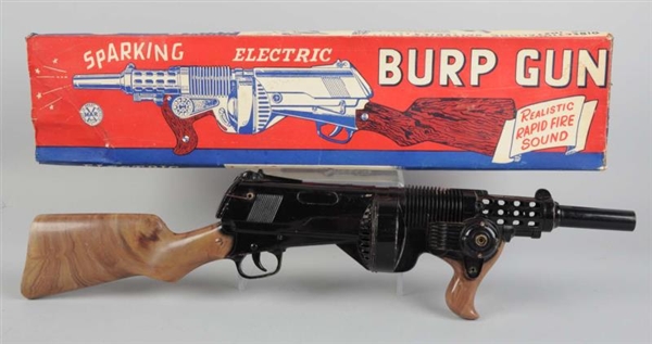 PLASTIC SPARKLING ELECTRIC BURP GUN IN BOX.       