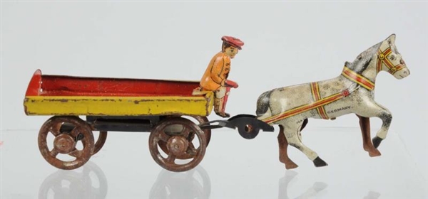 TIN HORSE WITH RIDER PENNY TOY.                   