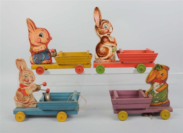 LOT OF 4: FISHER PRICE RABBIT ON CART TOYS.       
