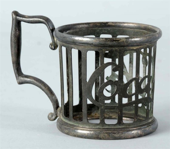 CIRCA 1905-1910 COCA-COLA PEWTER GLASS HOLDER.    