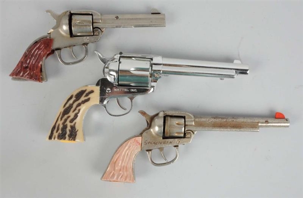 LOT OF 3: DIE - CAST & CAST METAL CAP GUNS.       