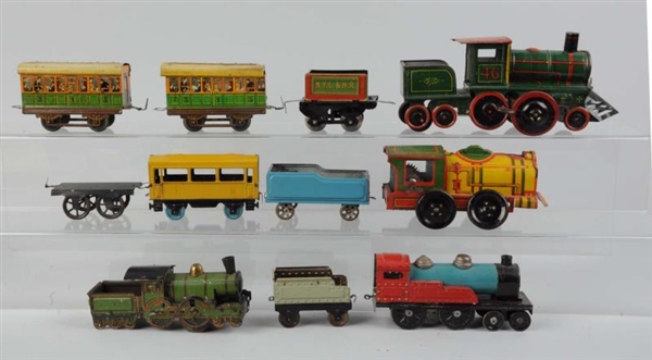 LOT OF 11: ASSORTED TOY TRAINS.                   