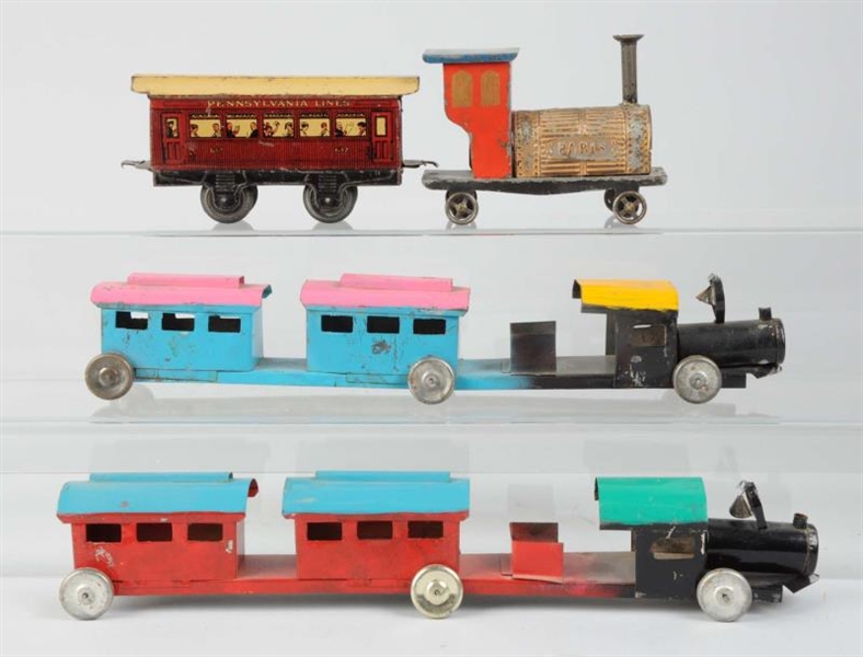 LOT OF 4: PROBABLY EARLY AMERICAN TIN TRAINS.     