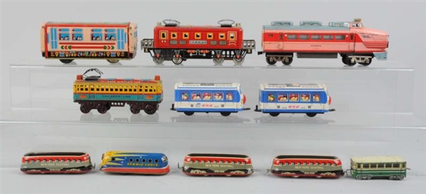 LOT OF 11: ASSORTED TIN LITHO TOY TRAINS.         