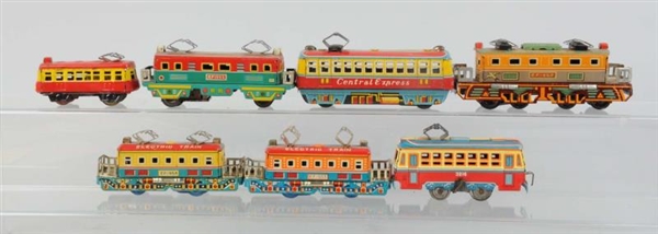 LOT OF 7: JAPANESE TIN TOY TRAINS.                