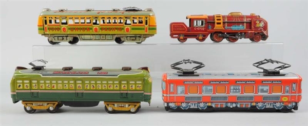 LOT OF 4: JAPANESE TIN TOY TRAINS.                