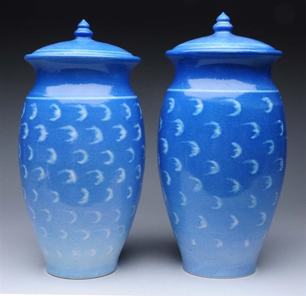 PAIR OF POTTERY COVERED VASES.                    