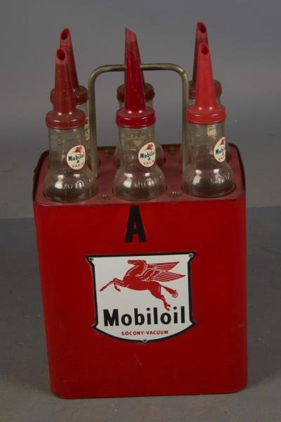 SIX PACK OF MOBILOIL GLASS OIL BOTTLES IN STAND   