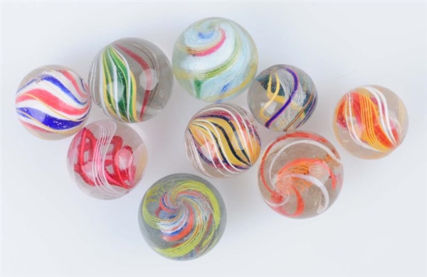 LOT OF 9: SWIRL MARBLES.                          