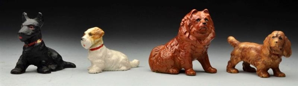 LOT OF 4: CAST IRON ASSORTED DOG PAPERWEIGHTS.    