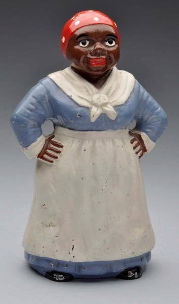 CAST IRON MAMMY WITH HANDS ON HIPS DOORSTOP.      