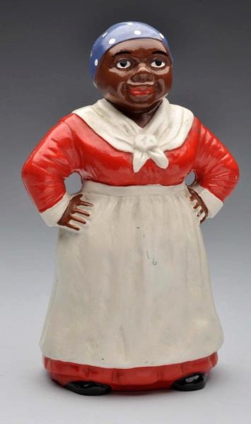 CAST IRON MAMMY WITH HANDS ON HIPS DOORSTOP.      