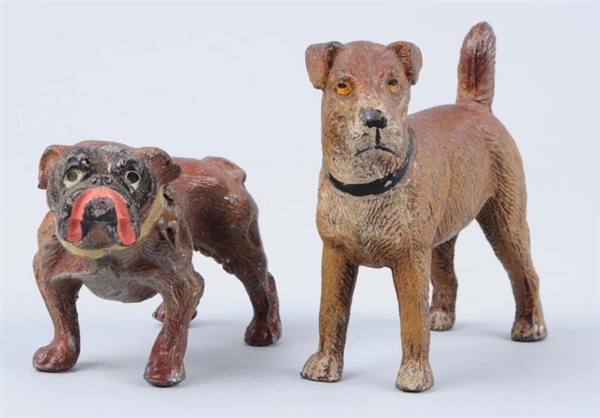 LOT OF 2: ANTIQUE GERMAN CAST IRON DOGS.          