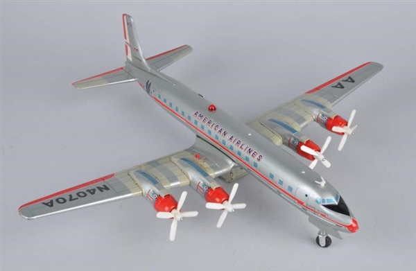 JAPANESE TIN LITHO BATTERY-OPERATED DC-7 AIRPLANE 