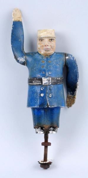 EARLY METAL POLICEMAN FIGURE WITH MOVING ARMS.    