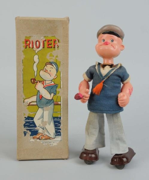 CELLULOID WIND-UP POPEYE THE RIOTER TOY.          