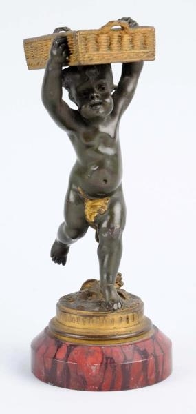 SMALL BRONZE OF BOY RUNNING WITH BASKET.          