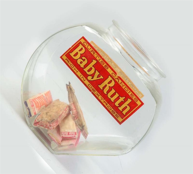 BABY RUTH GLASS CONTAINER WITH CANDY.             