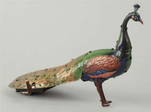 GERMAN TIN LITHO WIND-UP EBO PEACOCK TOY.         