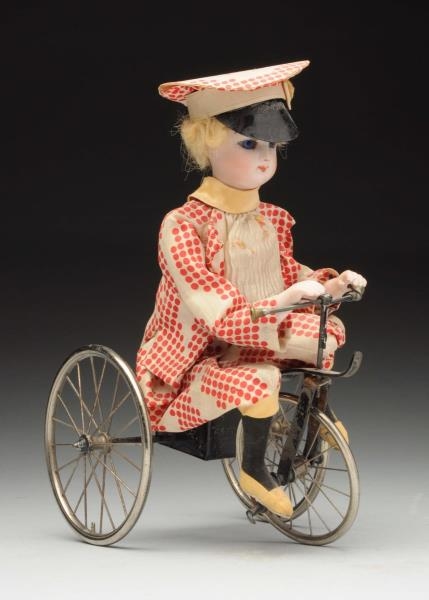 FRENCH MECHANICAL TRICYCLE TOY.                   