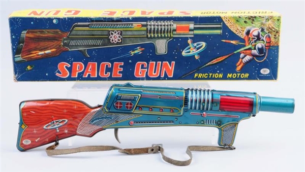 TIN LITHO FRICTION SPACE GUN.                     
