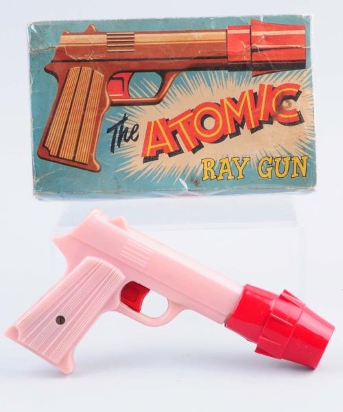 PLASTIC BATTERY - OPERATED ATOMIC RAY GUN.        