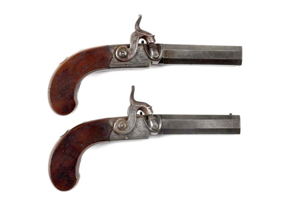 LOT OF 2: MATCHED PAIR ANTIQUE BOOT PISTOLS.      