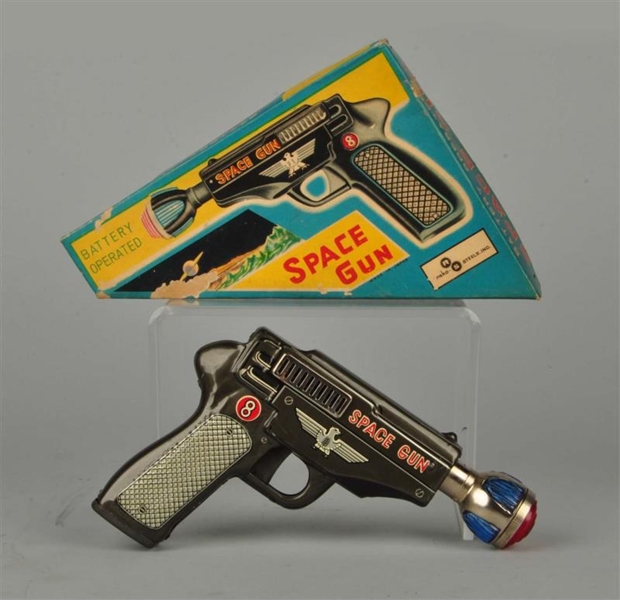 BATTERY OPERATED SPACE GUN IN BOX.                