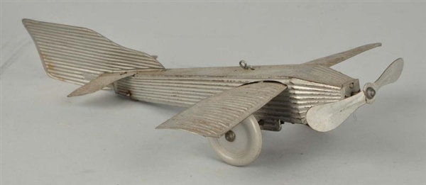 EARLY GERMAN WIND UP TIN AIRPLANE TOY.            