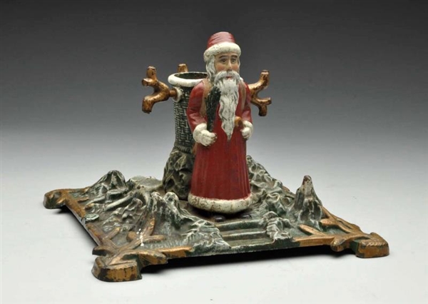 CAST IRON FATHER CHRISTMAS TREE STAND.            