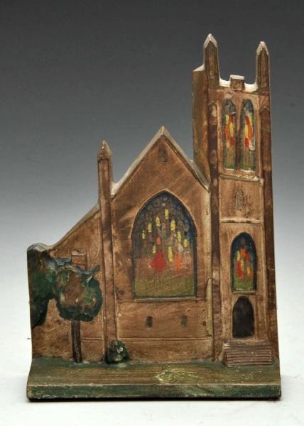 CAST IRON CHURCH WITH STAINED GLASS .             