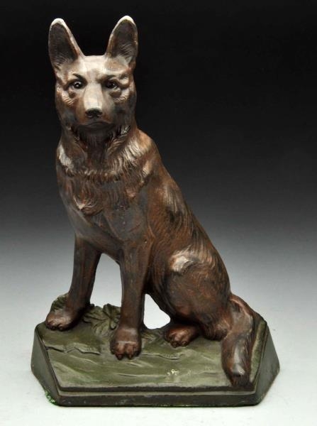 CAST IRON SITTING GERMAN SHEPHERD DOORSTOP.       