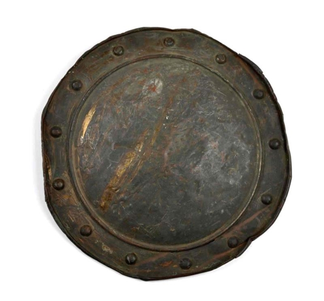 EARLY HAND HAMMERED BRASS SHIELD.                 