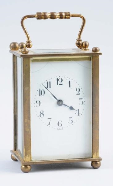SMALL BRASS CARRIAGE CLOCK.                       