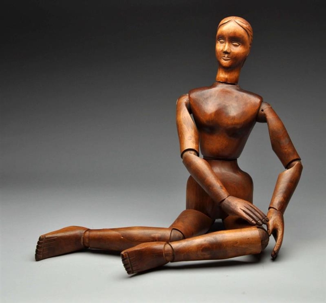 HAND-CARVED WOODEN JOINTED FEMALE FIGURE.         