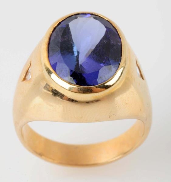 YELLOW GOLD RING WITH 8.5CT DEEP BLUE TANZANITE.  