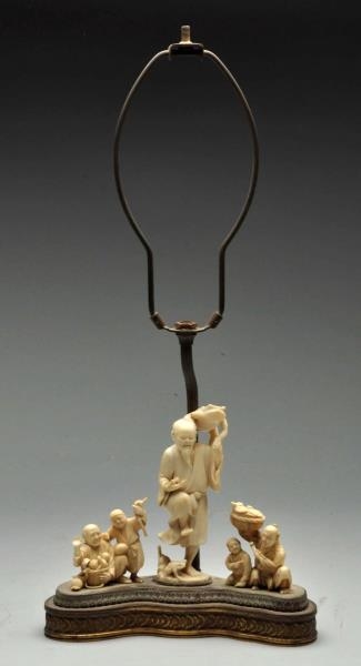 LAMP BASE WITH IVORY ASIAN FIGURES.               