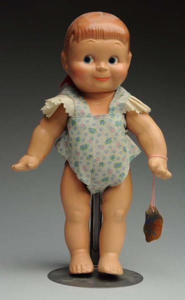 RARE COMPOSITION “GIGGLES” DOLL.                  