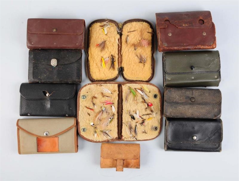LOT OF 11: LEATHER FLY WALLETS.                   