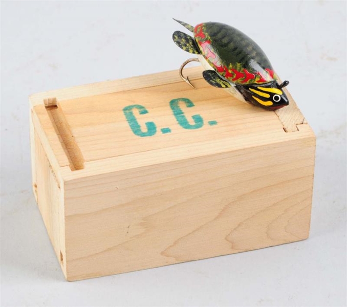 PAINTED TURTLE FISHING LURE IN A WOODEN BOX       