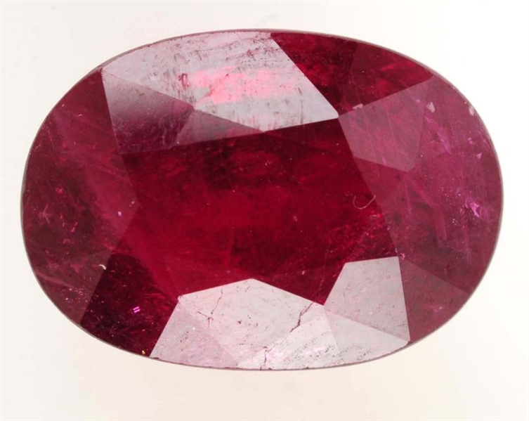 UNSET OVAL CUT RUBY.                              