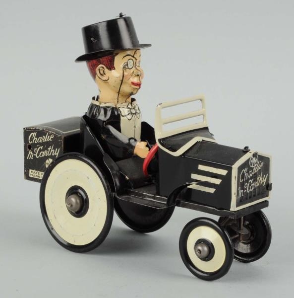 CHARLIE MCCARTHY TIN WIND-UP TOY CAR.             
