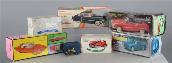 LOT OF 7: DIECAST CARS AND BOAT MOTOR             