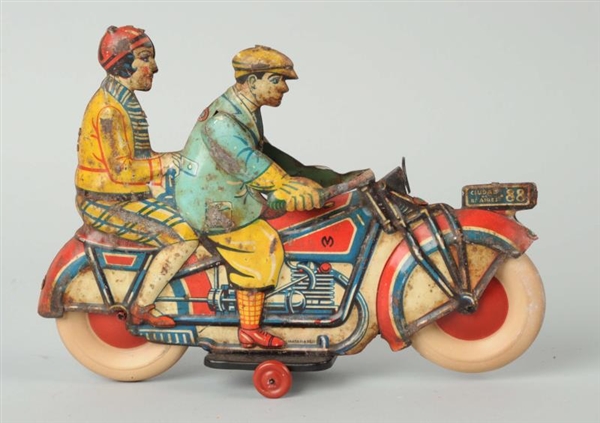 ARGENTINE MAN & WOMAN ON MOTORCYCLE TOY.          