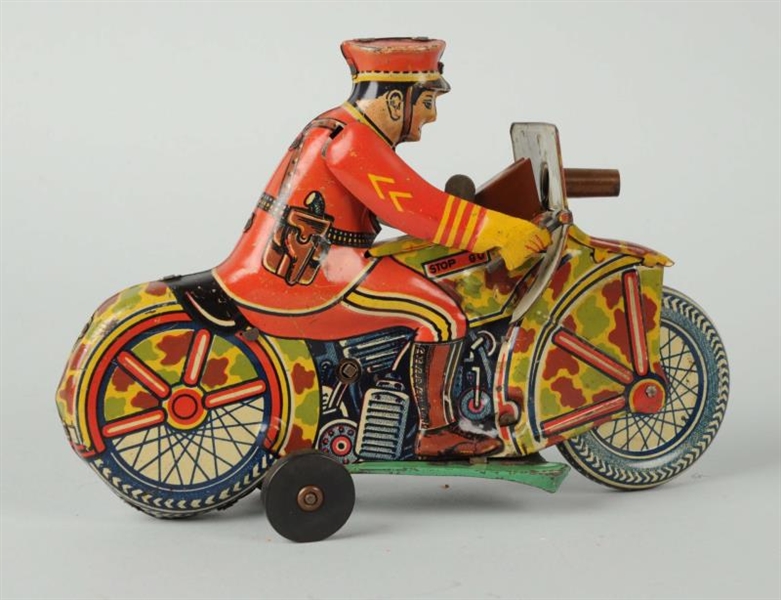MARX WIND-UP POLICEMAN ON MOTORCYCLE.             