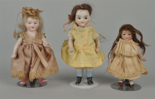 LOT OF 3: SMALL BISQUE DOLLS.                     