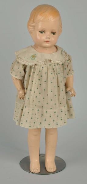 COMPOSITION DOLL WITH MOLDED HAIR.                