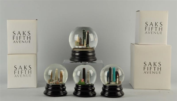 LOT OF 4: SAKS FIFTH AVENUE SNOW GLOBES.          
