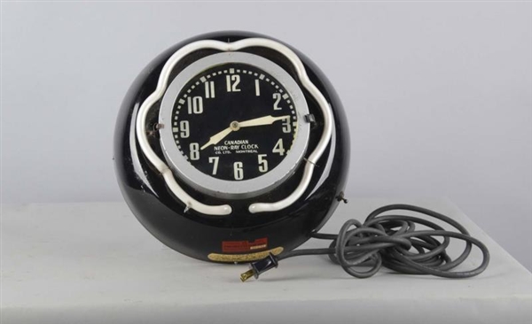 PORCELAIN CANADIAN NEON-RAY WALL CLOCK            